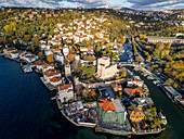 Aerial view of the historic anatolian fortress at sunset with beautiful houses and lush greenery along the bosphorus and goksu creek,Anadolu Hisari,Turkey