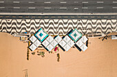 Aerial Top Down View Of Kiosk Restaurant Umbrellas On Empty Copacabana Beach,Alongside Famous Mosaic Sidewalk And Avenida Atlantica Road During Coronavirus Lockdown In Rio De Janeiro,Brazil
