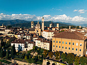 Aerial view of Basilica di Santa Maria Maggiore amidst charming medieval buildings and scenic mountains,Bergamo,Italy