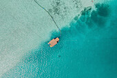 Aerial Top Down View of a floating House Surrounded By Clear Blue Ocean In South Male Atoll,Maldives