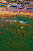 Aerial view of beautiful sandy beach with people and colorful parasols by the Black Sea,Sariyer,Turkey