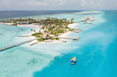 Aerial View Of Tropical Island Bridge Over Clear Blue Ocean And Luxury Resort,South Male Atoll Maldives