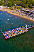 Aerial view of a beautiful beach with umbrellas and deck chairs along the Black Sea,Sariyer,Turkey