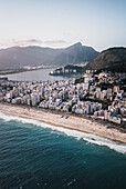 Aerial View Of Afternoon Light Shining Upon Rodrigo De Freitas Lagoon And Ipanema Beach With Christ The Redeemer In Background,Rio De Janeiro,Brazil