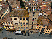 Aerial view of historic buildings and town square with beautiful rooftops,Arezzo,Italy