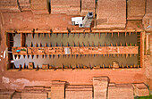 Aerial view of a brick factory with a small furnace chimney along Buriganga river,Keraniganj,Dhaka province,Bangladesh