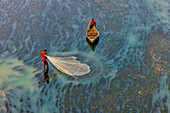 Badalgachhi,Bangladesh - 30 January 2021: Aerial view of fishermen on a canoe sailing the Jamuna river,Bangladesh
