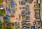 Aerial view of lorries loading oil barrels in a parking lot in Rupganj,Dhaka province,Bangladesh