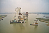 Aerial view of a building site while assembling the Padma bridge,the longest rail and highway bridge in Bangladesh crossing the Padma river,Zajira,Dhaka,Bangladesh