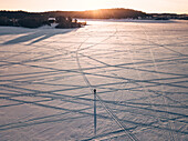 Aerial view of a man standing into the crossroads of the paths of winter Ladoga lake,Republic of Karelia,Sortavala,Russia
