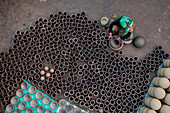 Sahajanpur,Bangladesh - 19 December 2021: Aerial view of a person working with clay pots in a factory,Bangladesh