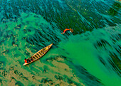 Badalgachhi,Bangladesh - 30 January 2021: Aerial view of fishermen on a canoe sailing the Jamuna river,Bangladesh