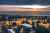 Aerial view of big stone in the autumn forest in time of the sunset with sitting people on the top,Usva,Perm Krai,Russia