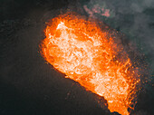 Aerial view of a lava explosion and the fog in Iceland