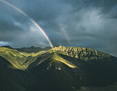 Aerial view of two rainbows after storm on the top of the mountains,Verkhnyaya Teberda,Karachay-cherkessia,Russia