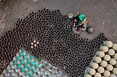 Sahajanpur,Bangladesh - 19 December 2021: Aerial view of a person working with clay pots in a factory,Bangladesh