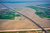 Aerial view of Padma bridge,over the padma river by day in lateral perspective,Shibchar,Dhaka,Bangladesh