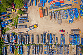 Aerial view of lorries loading oil barrels in a parking lot in Rupganj,Dhaka province,Bangladesh