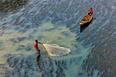 Badalgachhi,Bangladesh - 30 January 2021: Aerial view of fishermen on a canoe sailing the Jamuna river,Bangladesh