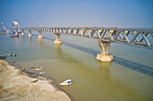 Aerial view of a building site while assembling the Padma bridge,the longest rail and highway bridge in Bangladesh crossing the Padma river,Zajira,Dhaka,Bangladesh