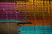 Aerial view of a person working in a public laundry hanging for drying colourful cloth in Narayanganj,Dhaka,Bangladesh