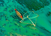 Badalgachhi,Bangladesh - 30 January 2021: Aerial view of fishermen on a canoe sailing the Jamuna river,Bangladesh