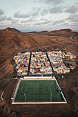 Aerial view of a soccer pitch and a little town,Las Coloradas,Spain