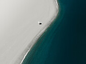Aerial view of an umbrella on a white beach,Sicily,Italy