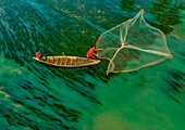 Badalgachhi,Bangladesh - 30 January 2021: Aerial view of fishermen on a canoe sailing the Jamuna river,Bangladesh