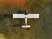 Aerial view of a two-seater ultralight airplane at ground in the airfield for maintenance in Senago,Lombardy,Italy