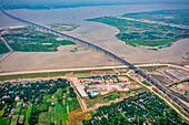 Aerial view of Padma bridge,over the padma river by day in lateral perspective,Shibchar,Dhaka,Bangladesh