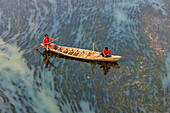 Badalgachhi,Bangladesh - 30 January 2021: Aerial view of fishermen on a canoe sailing the Jamuna river,Bangladesh