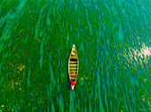 Badalgachhi,Bangladesh - 30 January 2021: Aerial view of fishermen on a canoe sailing the Jamuna river,Bangladesh