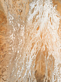 Aerial view of a desert landscape,where different colours of sand and salt forms abstract patterns in the ground,Coober Pedy,Australia. Top down perspective