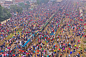 Gazipur,Bangladesh - 12 January 2020: Aerial view of a large congregation of people for a muslim festival on the top of trains at train station in Dhaka,Bangladesh