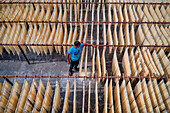 Barga,Bangladesh - 17 April 2022: Aerial view of People working on the production of typical natural fabric,Rajshahi