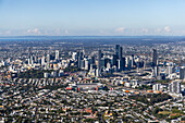 Aerial view of vibrant skyline and bustling cityscape with modern buildings and expansive residential areas,Bardon,Queensland,Australia