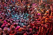 Nandgaon,India - 01 March 2023: Aerial view of people celebrating the holy colour festival at Shri And Baba Temple,Uttar Pradesh,India
