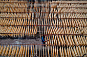 Barga,Bangladesh - 17 April 2022: Aerial view of People working on the production of typical natural fabric,Rajshahi