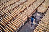 Barga,Bangladesh - 17 April 2022: Aerial view of People working on the production of typical natural fabric,Rajshahi