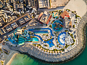 Aerial view above of luxury waterpark near the beach,U.A.E