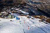 Aerial view of snow-covered Mount Buller ski resort with beautiful alpine landscape and clear blue sky,Victoria,Australia