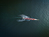 Aerial view of a single rowing boat and oarsmen in Dubai Creek,UAE