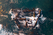 Aerial view of the Antipolis ship wreck with water rippling around it,taken with a long exposure,Cape Town,Western Cape,South Africa