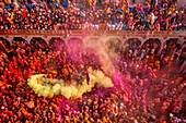 Nandgaon,India - 01 March 2023: Aerial view of people celebrating the holy colour festival at Shri And Baba Temple,Uttar Pradesh,India