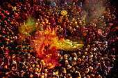 Nandgaon,India - 01 March 2023: Aerial view of people celebrating the holy colour festival at Shri And Baba Temple,Uttar Pradesh,India