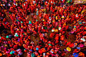Nandgaon,India - 01 March 2023: Aerial view of people celebrating the holy colour festival at Shri And Baba Temple,Uttar Pradesh,India