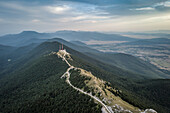 Aerial view of a old radar station on the mountain peak at the border between Croatia and Bosnia and Herzegovina next to the Zeljava Aibase