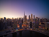 Aerial view of Dubai downtown with Burj Khalifa world's tallest skyscraper and city skyline in background at sunset,Dubai,United Arab Emirates