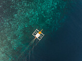 Aerial view of single filipino fishing boat near Lapu-Lapu city,Philippines